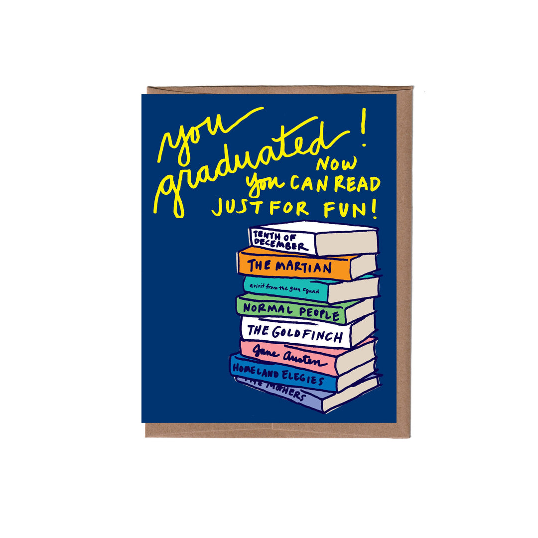 Congratulations card with illustration of books and text reading "you graduated! NOW you CAN READ JUST FOR FUN!" on a blue background