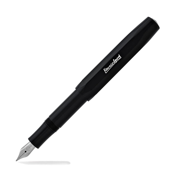 Black skyline fountain pen with silver nib and branding, with cap placed on pen end.