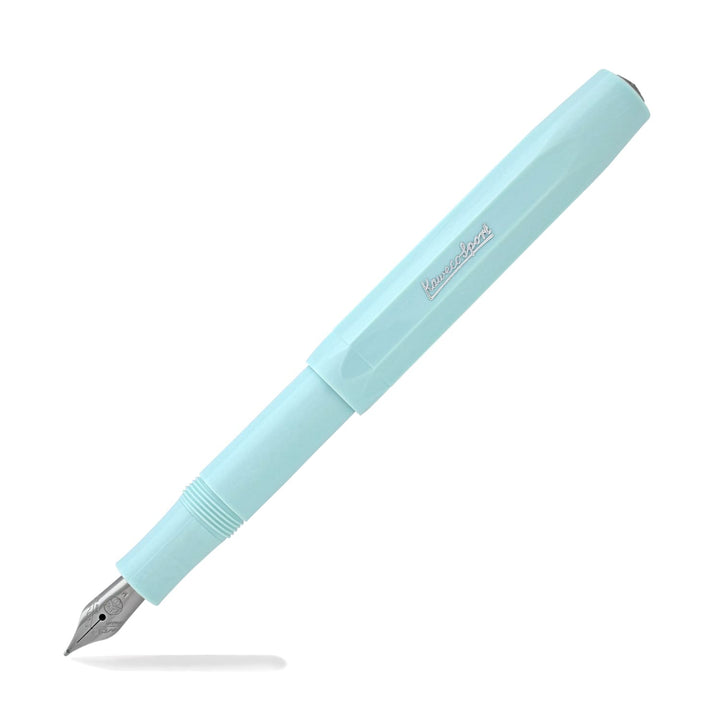 Mint (light blue) skyline fountain pen with silver nib and branding, with cap placed on pen end.