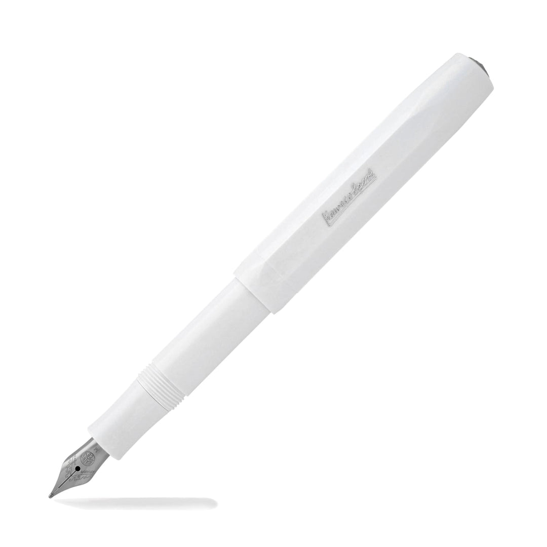 White skyline fountain pen with silver nib and branding, with cap placed on pen end.