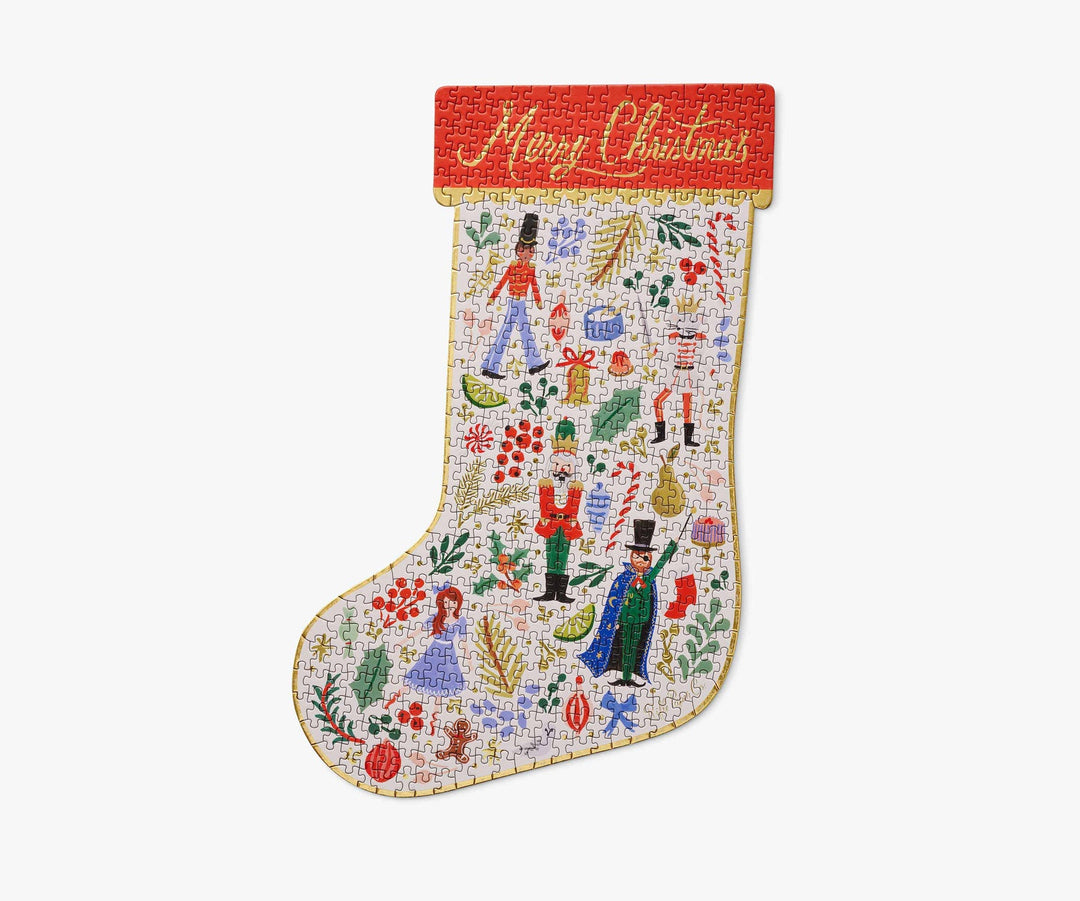 Completed puzzle in the shape of a stocking with "Merry Christmas" at the top and Nutcracker characters and various other Christmas images.