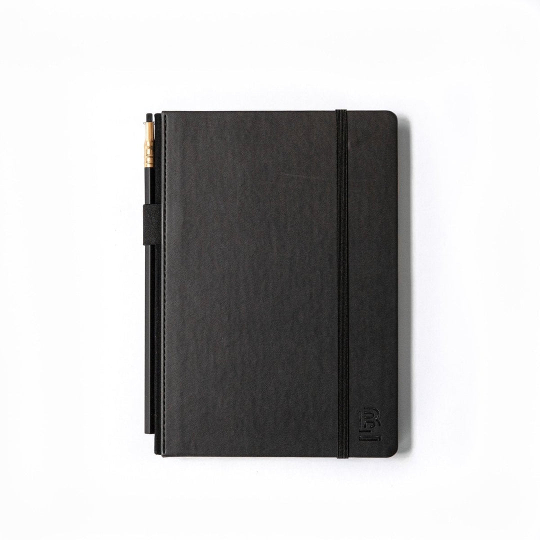 Black notebook with a pencil in holder and elastic closure band.