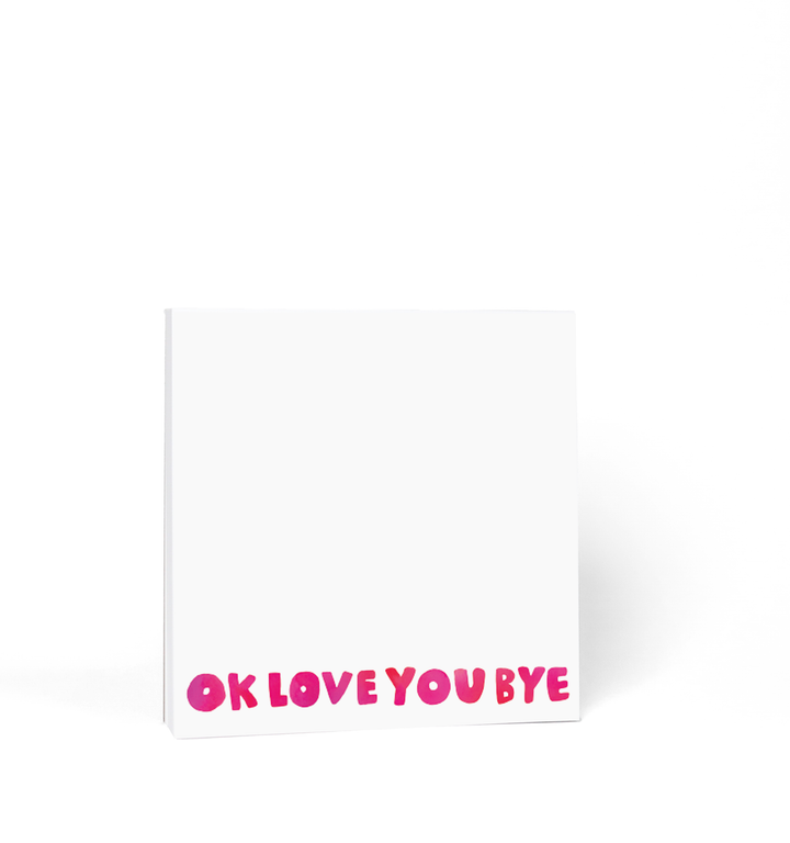Square notepad with white pages and "OKLOVEYOUBYE" in red across the bottom.