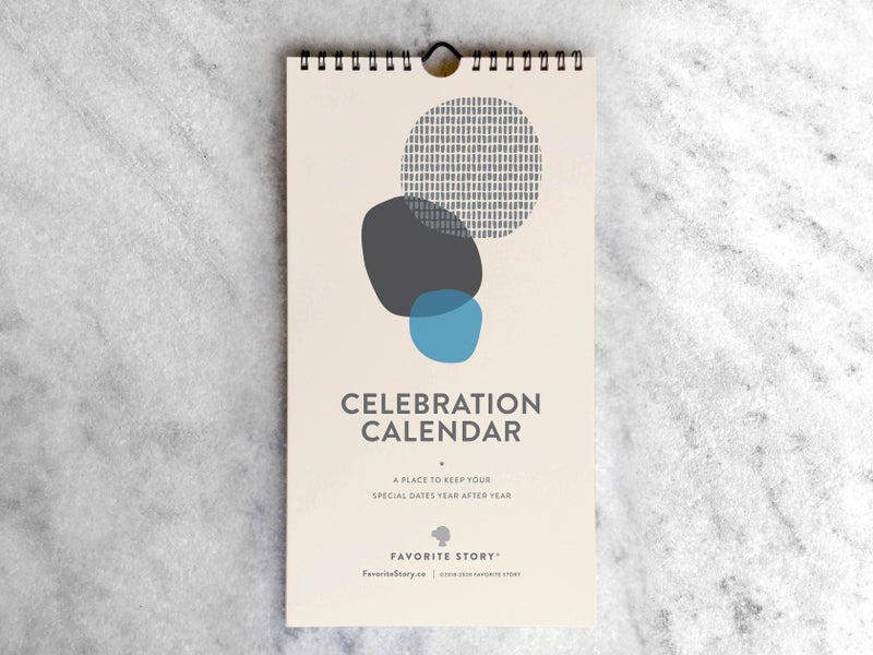 A calendar with abstract designs, titled 'CELEBRATION CALENDAR', by Favorite Story, with a twin-loop binding and a hanger at the top.