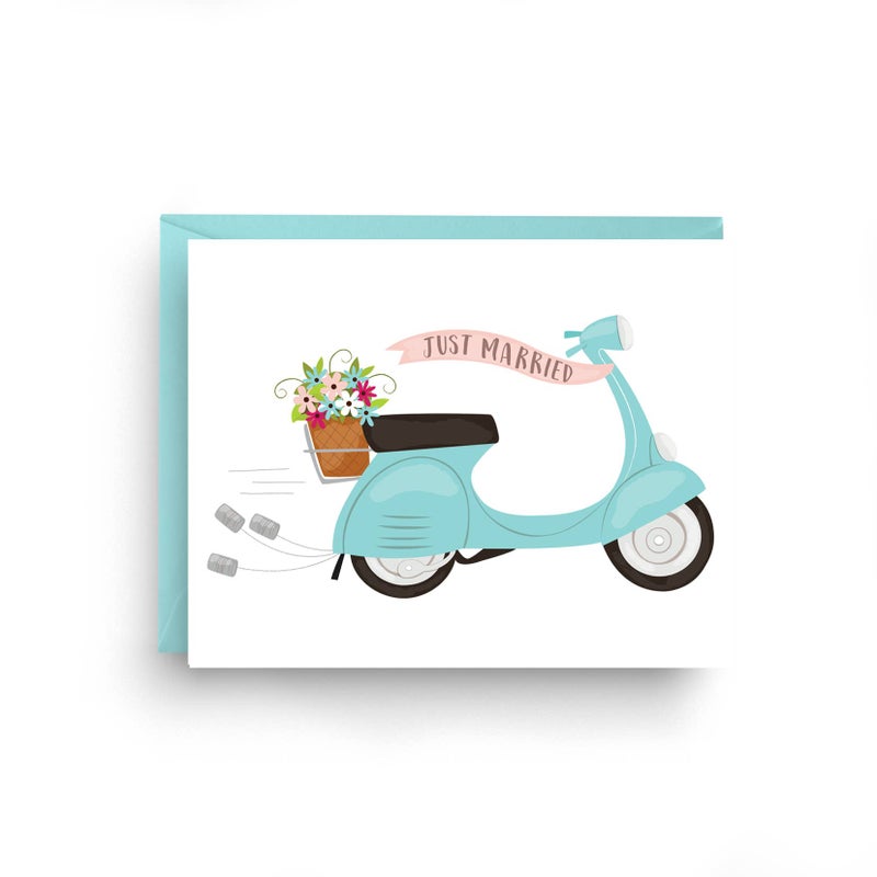 Greeting card with drawing of scooter with tin cans tied to back, flowers in carry basket and banner reading Just married.