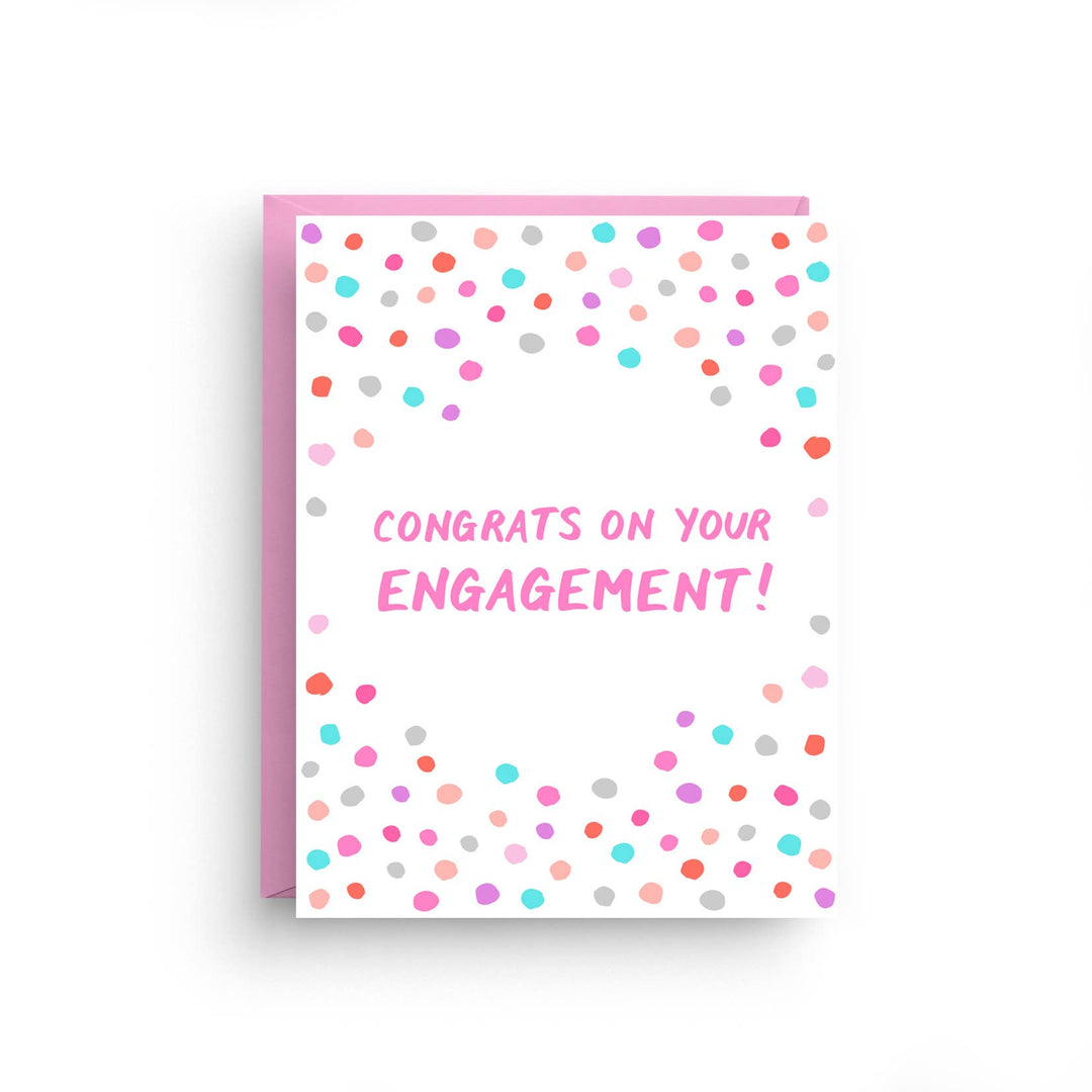 Greeting card with multi-colored dots and pink text: Congrats on your engagement! Pink envelope.