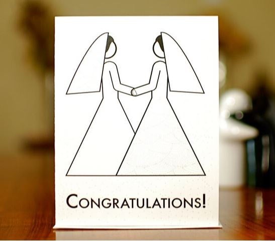 Greeting card with abstract drawing of two brides clasping hands and the text Congratulations