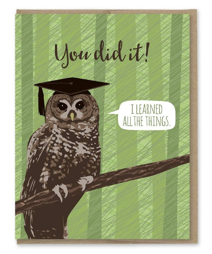 Owl sitting on branch wearing mortarboard on a green background suggesting a forest.