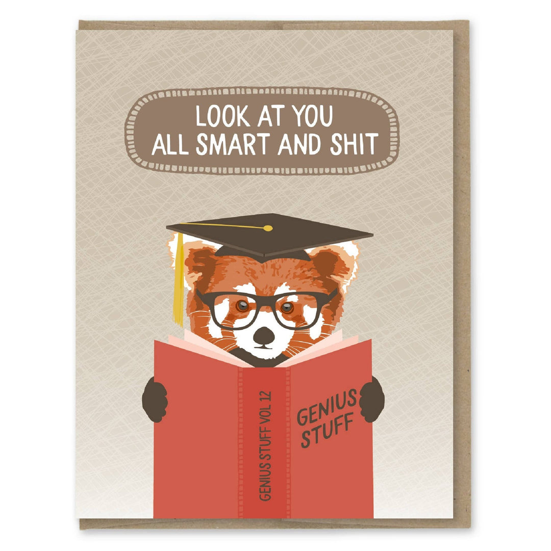 Red panda wearing oversize glasses and a mortarboard reading a book titled Genius Stuff.