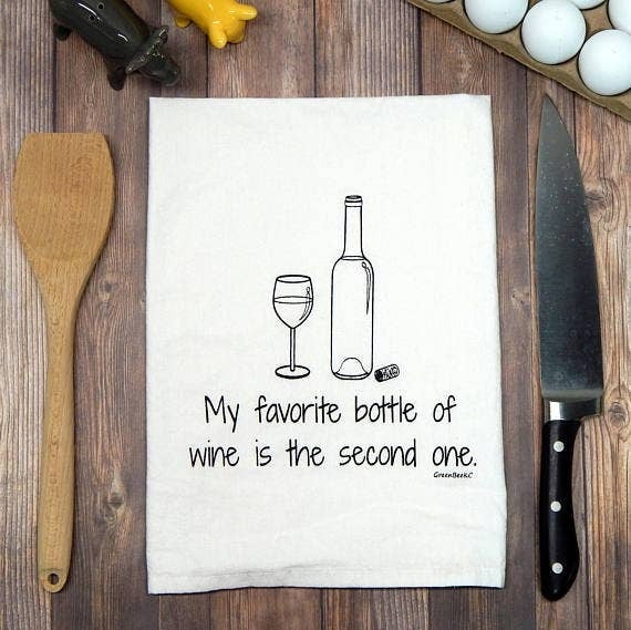 Hand drawn black and white drawing of a wine bottle and glass, with cork on side, above the text "My favorite bottle of wine is the second one."