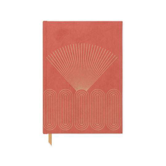 Gold rays over concentric ovals on an orange cover.