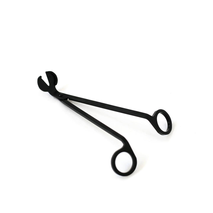 Scissors-like black wick trimmer.