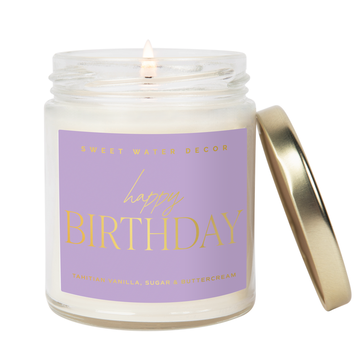 Scented soy candle in clear glass container with metal lid. Label is Happy Birthday  Tahitian Vanilla / Sugar / Buttercream