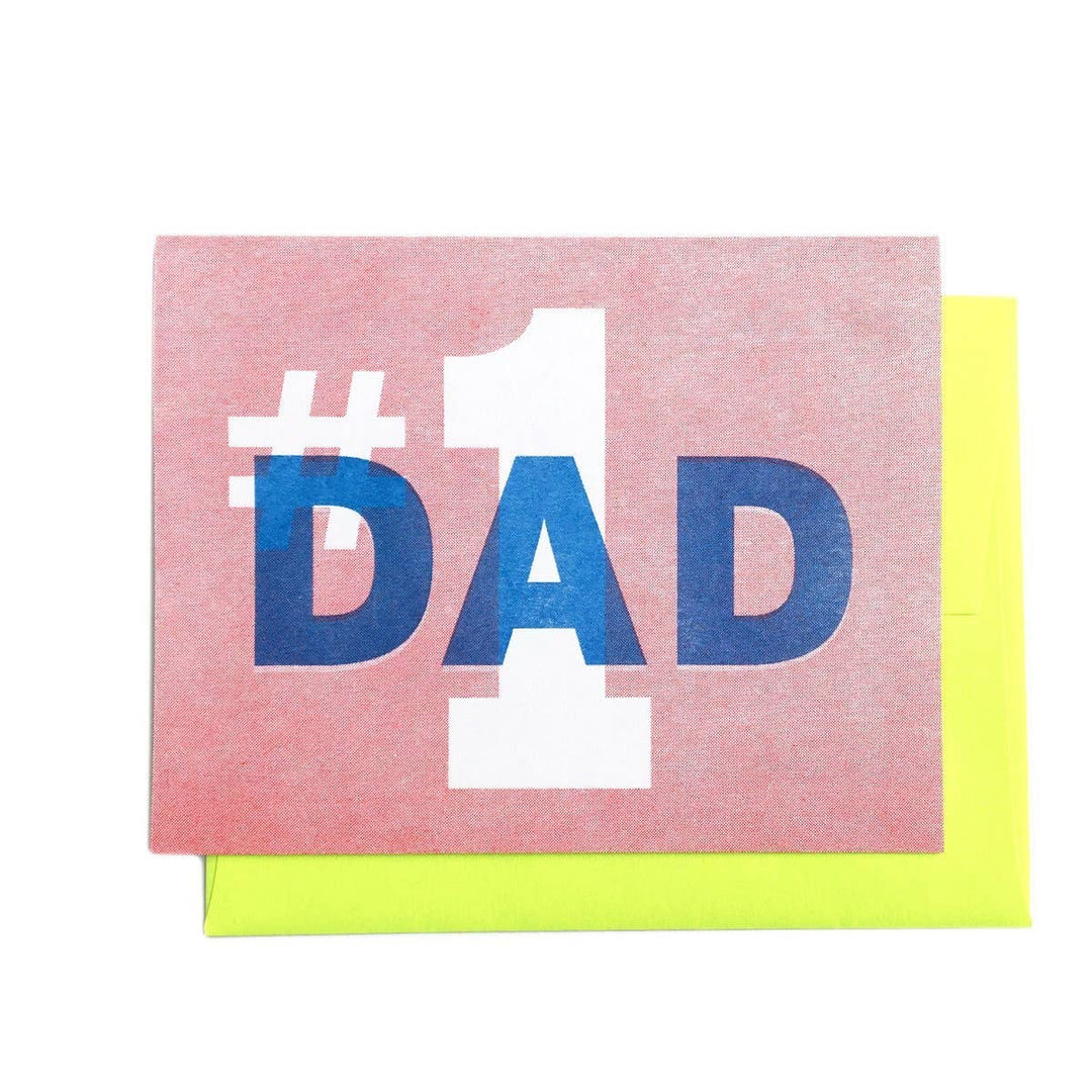 Pink card with large text #1 in white and DAD in blue. Bright yellow envelope.