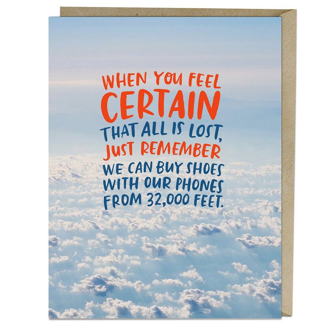 Photo above white fluffy clouds and blue sky. Text in red and blue in a font that looks handwritten.