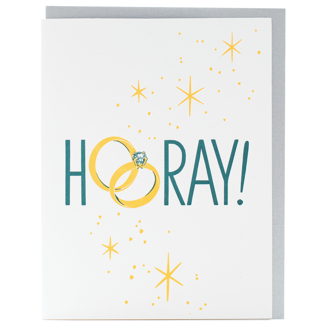 Greeting card with text Hooray with wedding rings as the letters o surronded by stars