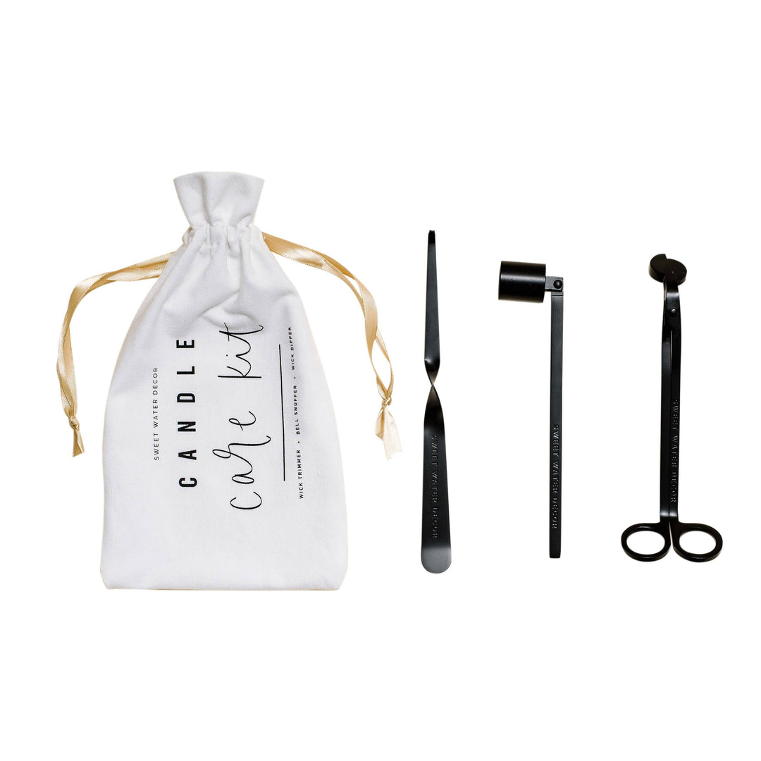 Candle care kit bag with wick dipper, candle snuffer and wick trimmer in black.