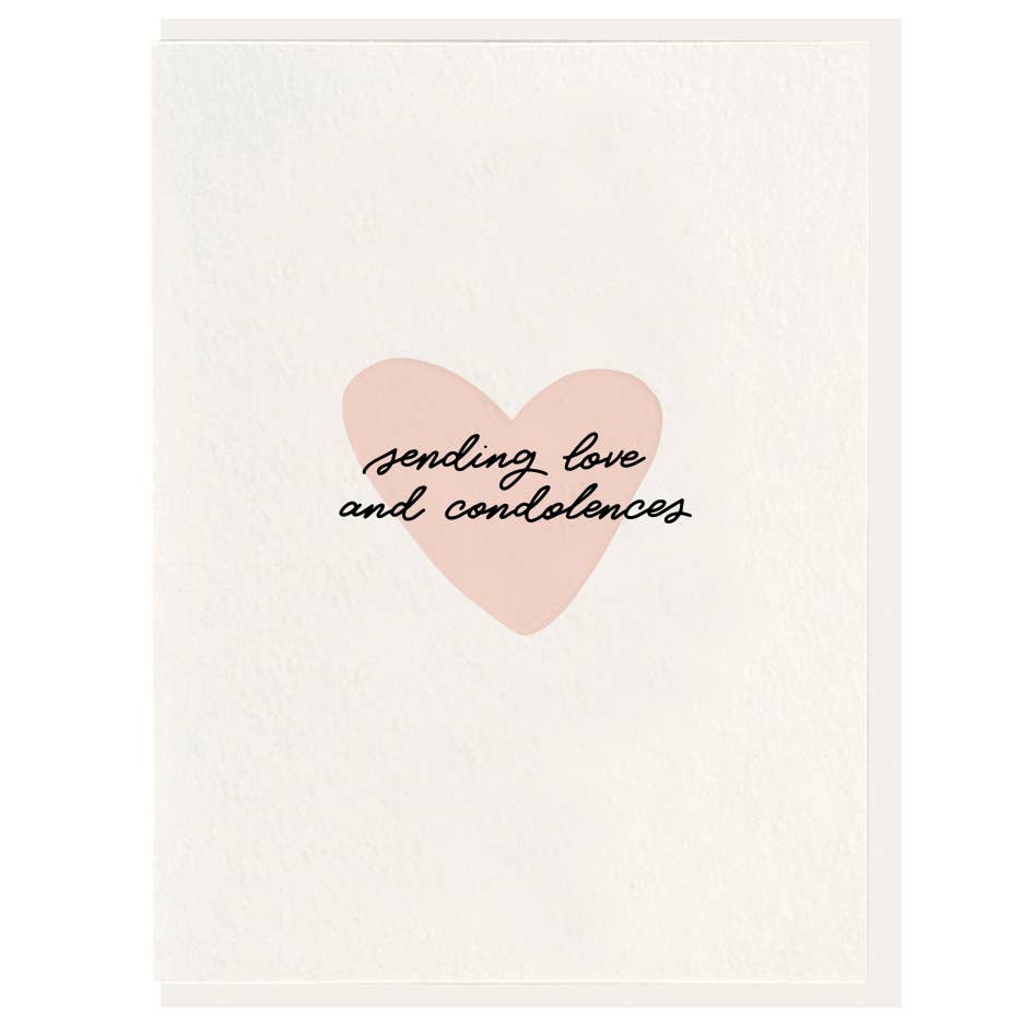 Cursive text on a pink heart against a lighter pink background.